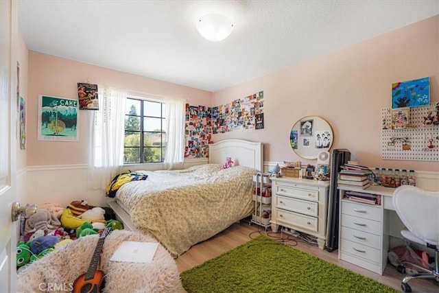 3931 Cottonwood Grove Trl, Calabasas, CA 91301 - bedroom featuring a wainscoted wall and light wood-type flooring