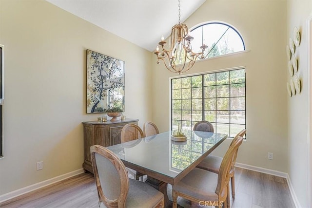 3931 Cottonwood Grove Trl, Calabasas, CA 91301 - dining area featuring a chandelier, light wood-style floors, and high vaulted ceiling