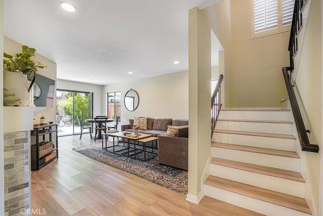 3931 Cottonwood Grove Trl, Calabasas, CA 91301 - living room with stairway, light wood-style flooring, and recessed lighting