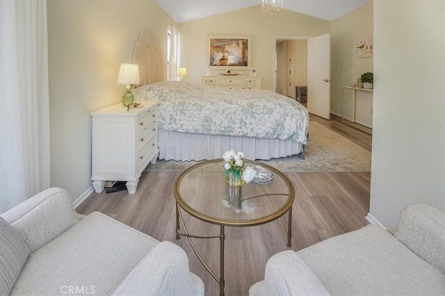3931 Cottonwood Grove Trl, Calabasas, CA 91301 - bedroom featuring light wood finished floors and vaulted ceiling