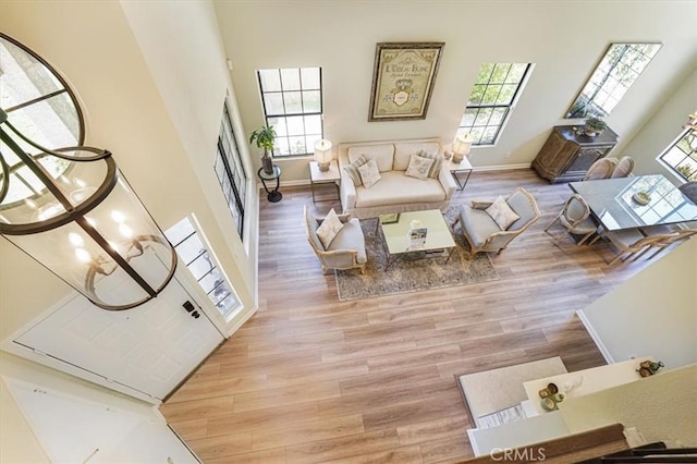 3931 Cottonwood Grove Trl, Calabasas, CA 91301 - living area featuring wood finished floors and a high ceiling