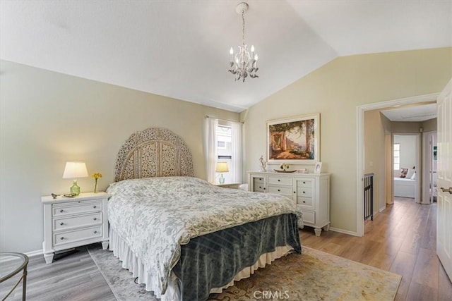 3931 Cottonwood Grove Trl, Calabasas, CA 91301 - bedroom with vaulted ceiling, a chandelier, and light wood-style floors