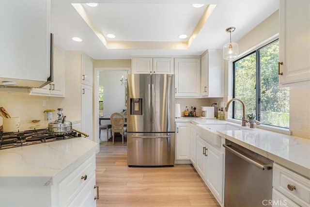 3931 Cottonwood Grove Trl, Calabasas, CA 91301 - kitchen with appliances with stainless steel finishes, white cabinetry, light wood-style floors, decorative backsplash, and recessed lighting