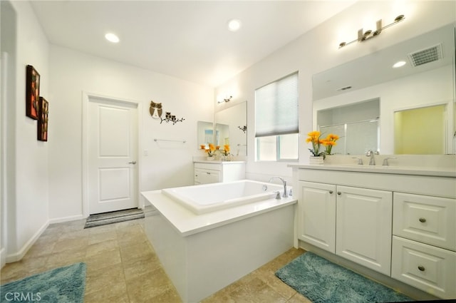 5073 S Mccleve Way W, Ontario, CA 91762 - bathroom featuring a garden tub, vanity, a stall shower, tile patterned flooring, and recessed lighting