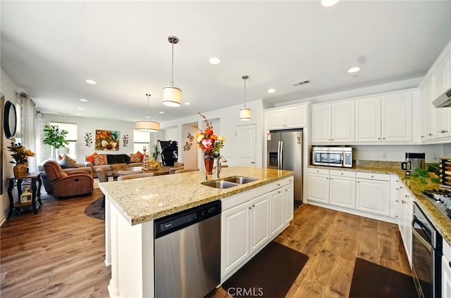 5073 S Mccleve Way W, Ontario, CA 91762 - kitchen featuring appliances with stainless steel finishes, recessed lighting, light wood-style floors, and white cabinetry