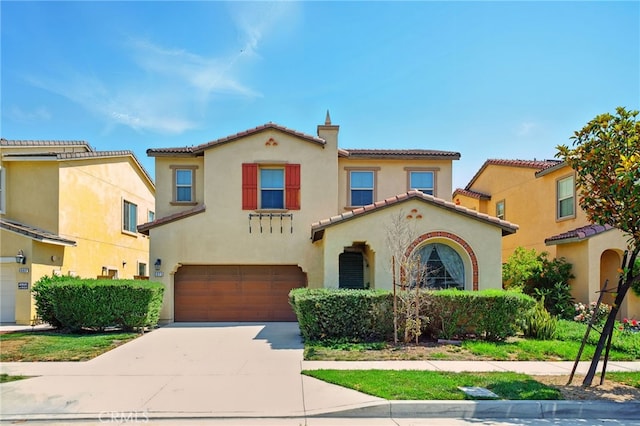 5073 S Mccleve Way W, Ontario, CA 91762 - mediterranean / spanish house featuring stucco siding, an attached garage, concrete driveway, and a tiled roof