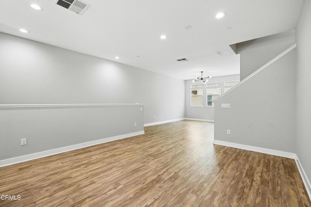 623 W Foothill Blvd Unit 43, Glendora, CA 91741 - unfurnished room featuring a chandelier, wood finished floors, recessed lighting, and stairway