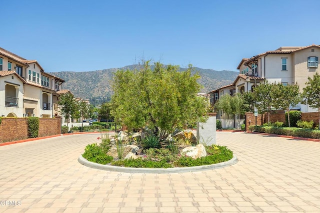 623 W Foothill Blvd Unit 43, Glendora, CA 91741 - view of property's community with a mountain view and curved driveway
