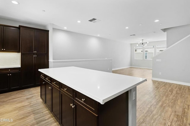 623 W Foothill Blvd Unit 43, Glendora, CA 91741 - kitchen with light wood-style floors, light countertops, a chandelier, recessed lighting, and a center island