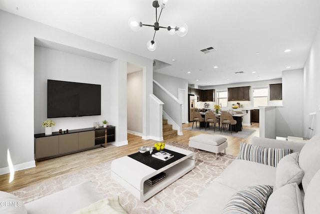 623 W Foothill Blvd Unit 43, Glendora, CA 91741 - living area with stairway, light wood-style flooring, recessed lighting, and a chandelier