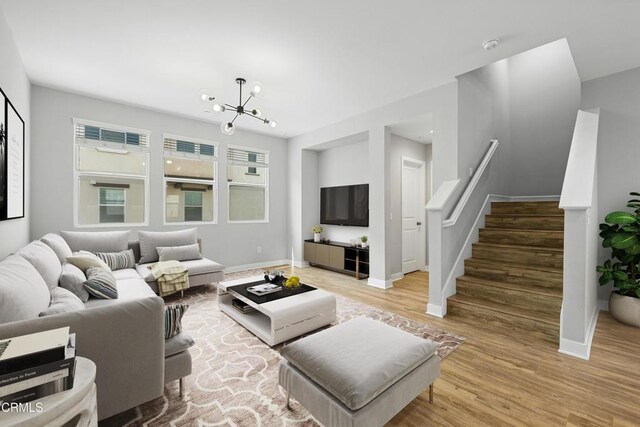 623 W Foothill Blvd Unit 43, Glendora, CA 91741 - living area with wood finished floors, stairway, and a chandelier