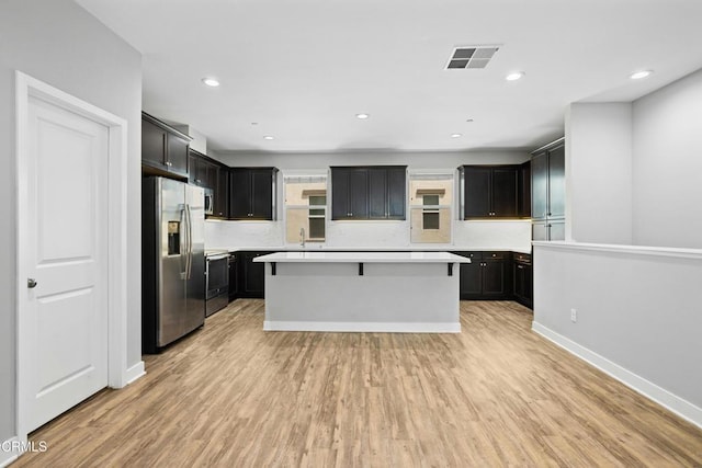 623 W Foothill Blvd Unit 43, Glendora, CA 91741 - kitchen featuring stainless steel appliances, light wood-style floors, a kitchen island, light countertops, and recessed lighting