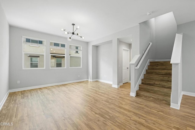 623 W Foothill Blvd Unit 43, Glendora, CA 91741 - unfurnished living room featuring wood finished floors, a chandelier, and stairs