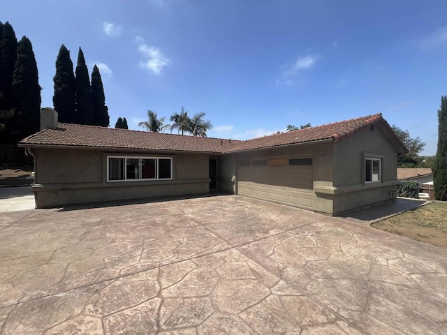 337 Rebecca Ave, Vista, CA 92084 - ranch-style house featuring a tile roof, stucco siding, and a garage