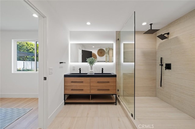 8840 Valjean Ave, North Hills, CA 91343 - bathroom with double vanity, a walk in shower, and recessed lighting