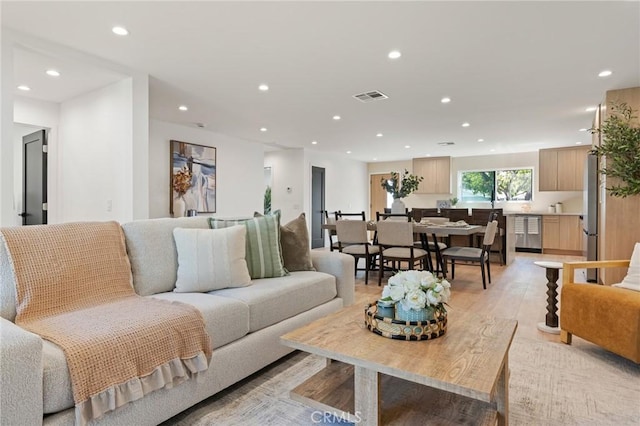 8840 Valjean Ave, North Hills, CA 91343 - living area with recessed lighting and light wood-style flooring