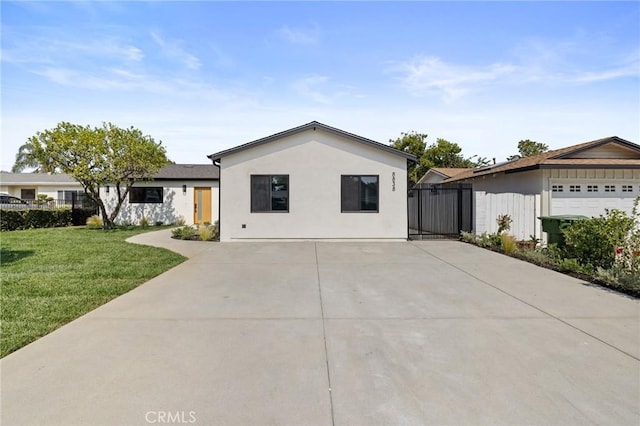 8840 Valjean Ave, North Hills, CA 91343 - ranch-style house with a front lawn, concrete driveway, and stucco siding