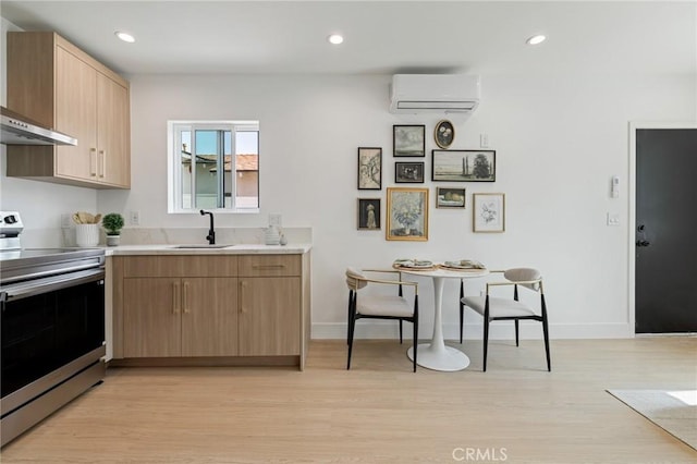 8840 Valjean Ave, North Hills, CA 91343 - kitchen with stainless steel electric range, a wall mounted AC, wall chimney exhaust hood, light countertops, and light wood finished floors
