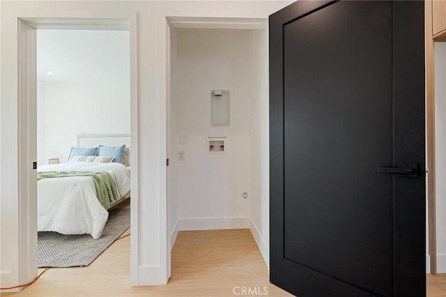8840 Valjean Ave, North Hills, CA 91343 - washroom featuring washer hookup and light wood-style floors