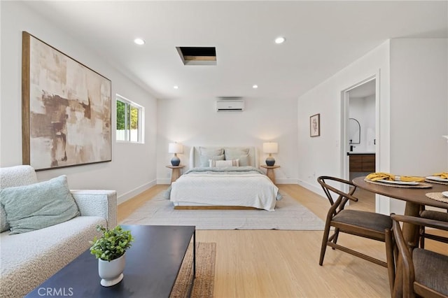 8840 Valjean Ave, North Hills, CA 91343 - bedroom featuring a wall mounted air conditioner, light wood-type flooring, and recessed lighting