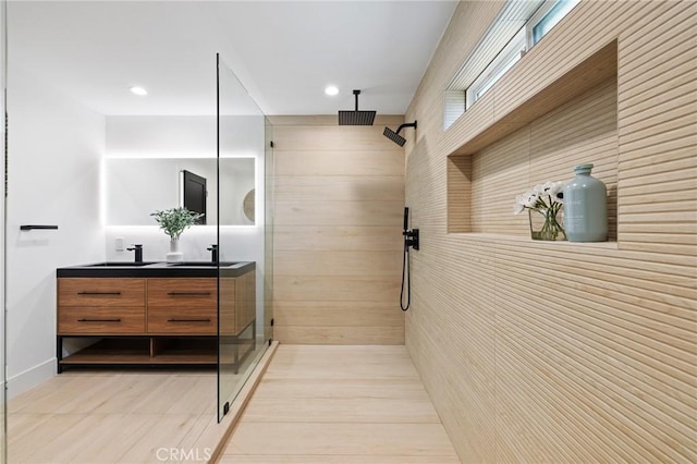 8840 Valjean Ave, North Hills, CA 91343 - full bath with double vanity, a tile shower, and recessed lighting