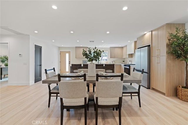 8840 Valjean Ave, North Hills, CA 91343 - dining area with light wood-style floors and recessed lighting