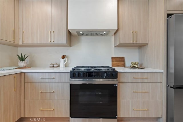 8840 Valjean Ave, North Hills, CA 91343 - kitchen featuring gas range and light brown cabinetry