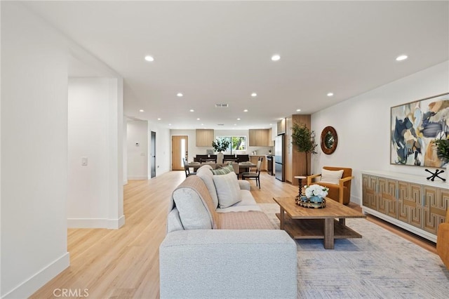 8840 Valjean Ave, North Hills, CA 91343 - living room with light wood-type flooring and recessed lighting