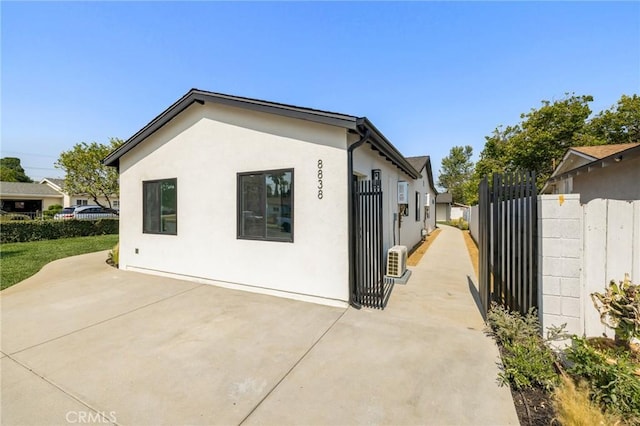 8840 Valjean Ave, North Hills, CA 91343 - view of property exterior featuring stucco siding and a patio