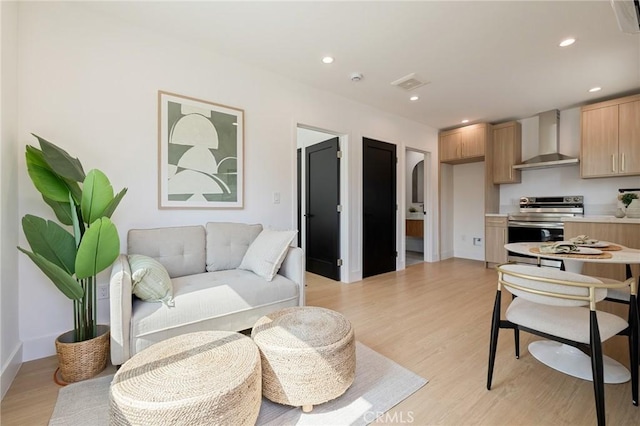 8840 Valjean Ave, North Hills, CA 91343 - living area featuring light wood-type flooring and recessed lighting