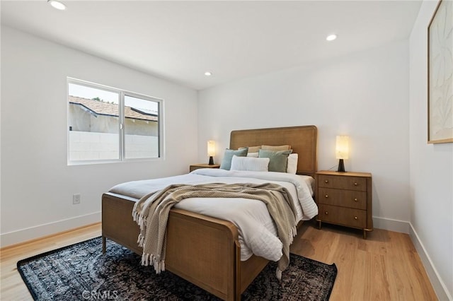 8840 Valjean Ave, North Hills, CA 91343 - bedroom with light wood-style flooring and recessed lighting