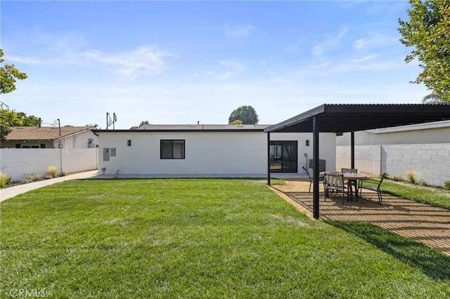 8840 Valjean Ave, North Hills, CA 91343 - rear view of property featuring stucco siding and a patio
