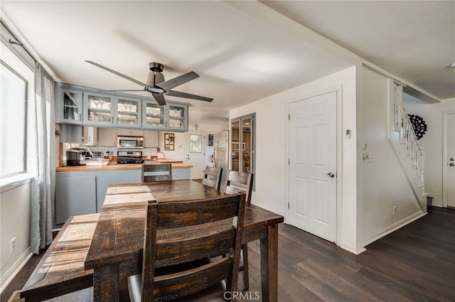 25389 Oak Glen Rd, Twin Peaks, CA 92391 - dining space featuring dark wood-style floors, a ceiling fan, and stairs