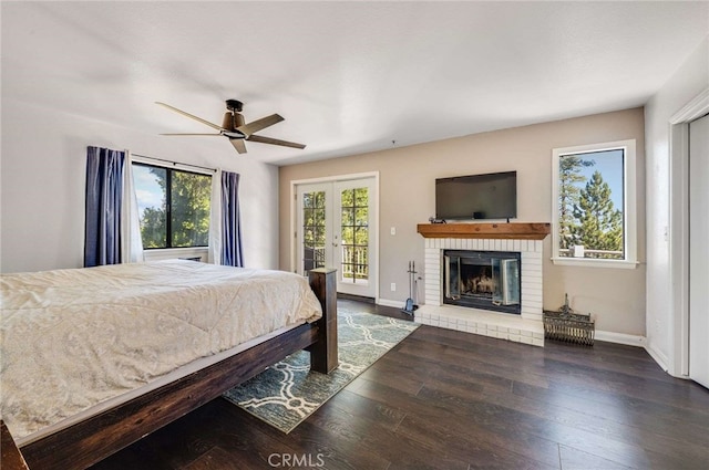 25389 Oak Glen Rd, Twin Peaks, CA 92391 - bedroom featuring access to outside, wood finished floors, a brick fireplace, french doors, and a ceiling fan