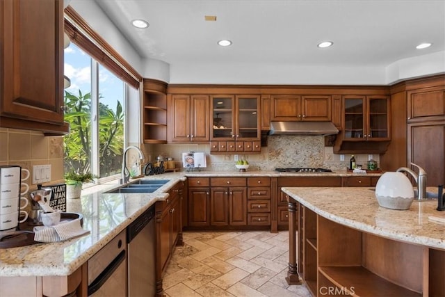 20342 Via Cellini, Porter Ranch, CA 91326 - kitchen with open shelves, under cabinet range hood, stainless steel appliances, brown cabinetry, and tasteful backsplash