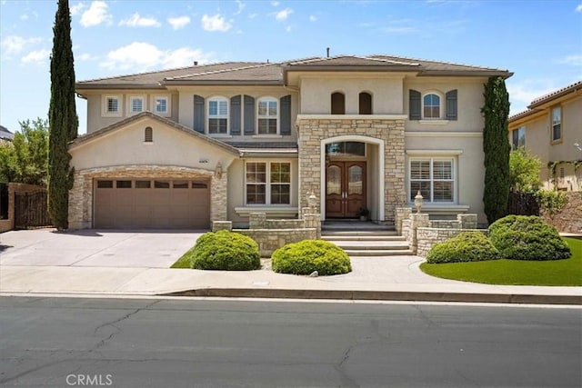 20342 Via Cellini, Porter Ranch, CA 91326 - mediterranean / spanish home with stucco siding, stone siding, and driveway