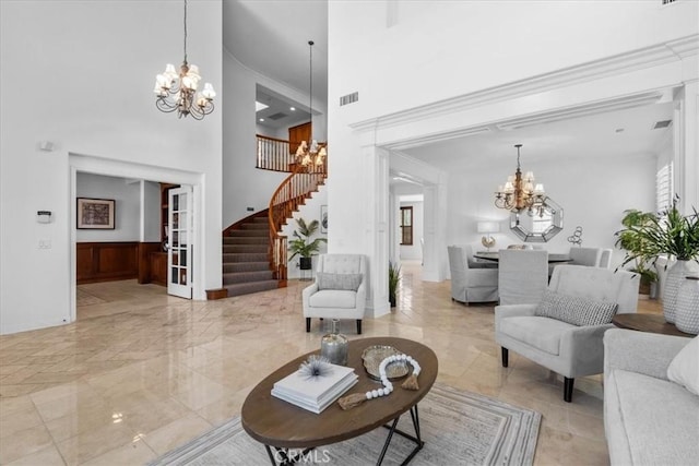 20342 Via Cellini, Porter Ranch, CA 91326 - living area featuring a chandelier, stairway, a high ceiling, and light marble finish flooring