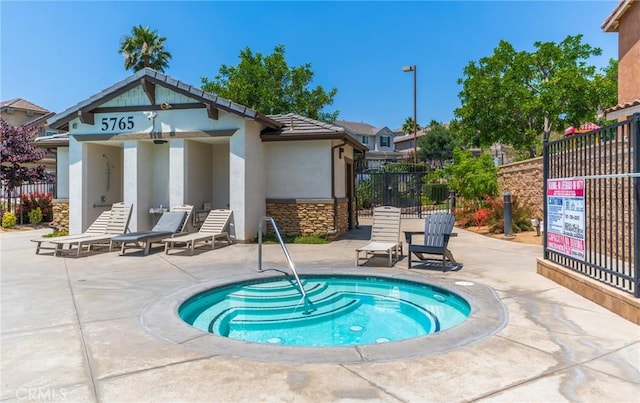 5681 Mapleview Dr, Jurupa Valley, CA 92509 - view of pool with a patio and a community hot tub