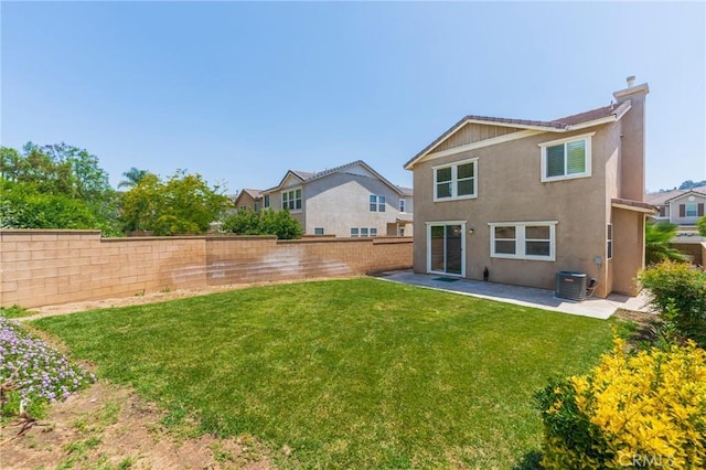 5681 Mapleview Dr, Jurupa Valley, CA 92509 - rear view of property with a fenced backyard, a patio area, a chimney, and stucco siding