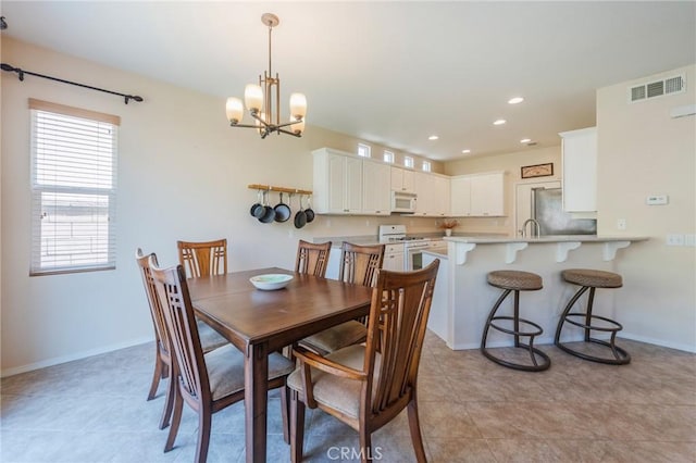 5681 Mapleview Dr, Jurupa Valley, CA 92509 - dining area featuring a chandelier, recessed lighting, and light tile patterned floors