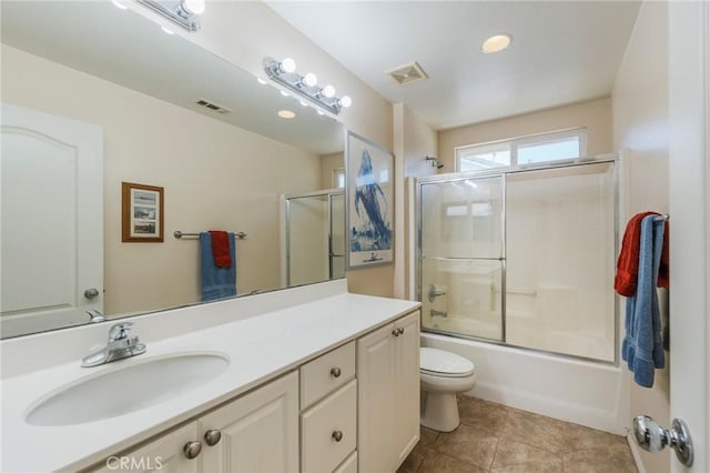 5681 Mapleview Dr, Jurupa Valley, CA 92509 - full bathroom with vanity, bath / shower combo with glass door, and tile patterned flooring