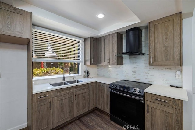 1806 N Fairview St Unit J, Santa Ana, CA 92706 - kitchen with range with electric cooktop, wall chimney range hood, tasteful backsplash, a tray ceiling, and dark wood-style floors