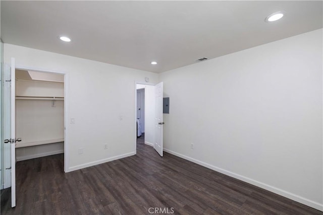 1806 N Fairview St Unit J, Santa Ana, CA 92706 - unfurnished bedroom featuring wood finished floors, a walk in closet, recessed lighting, electric panel, and a closet