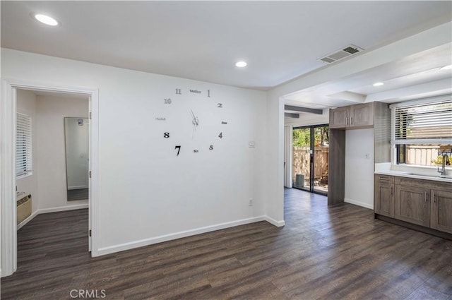 1806 N Fairview St Unit J, Santa Ana, CA 92706 - unfurnished room featuring dark wood finished floors and recessed lighting