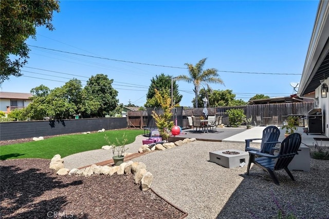450 Pecan St, Arroyo Grande, CA 93420 - fenced backyard featuring a fire pit, a patio area, and outdoor dining area