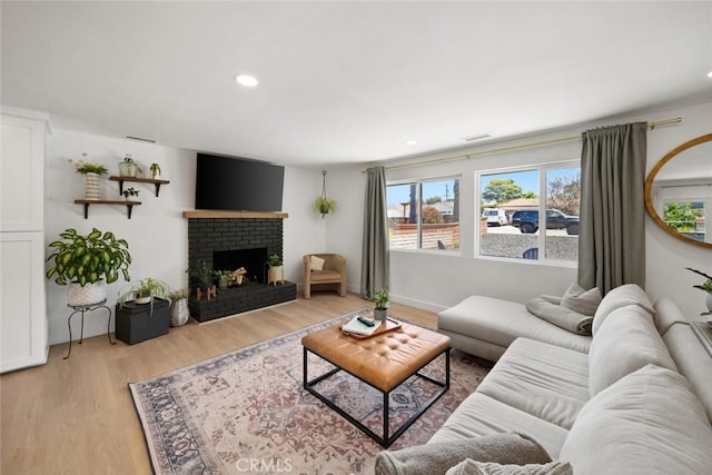 450 Pecan St, Arroyo Grande, CA 93420 - living room with light wood-style flooring, a fireplace, and recessed lighting