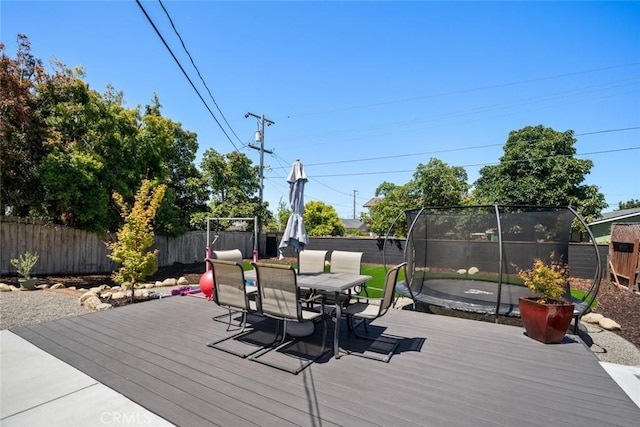 450 Pecan St, Arroyo Grande, CA 93420 - wooden deck featuring a trampoline, a fenced backyard, and outdoor dining area