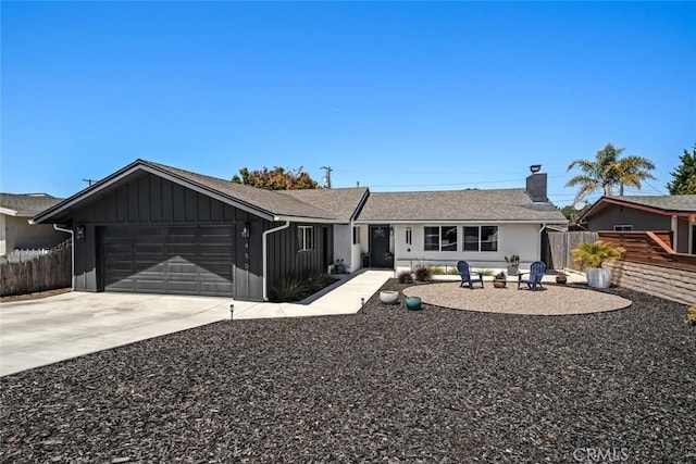 450 Pecan St, Arroyo Grande, CA 93420 - single story home with an attached garage, a chimney, board and batten siding, concrete driveway, and roof with shingles