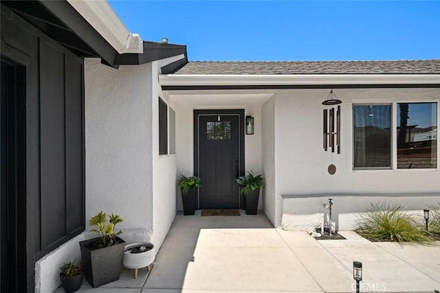 450 Pecan St, Arroyo Grande, CA 93420 - doorway to property featuring stucco siding and a shingled roof
