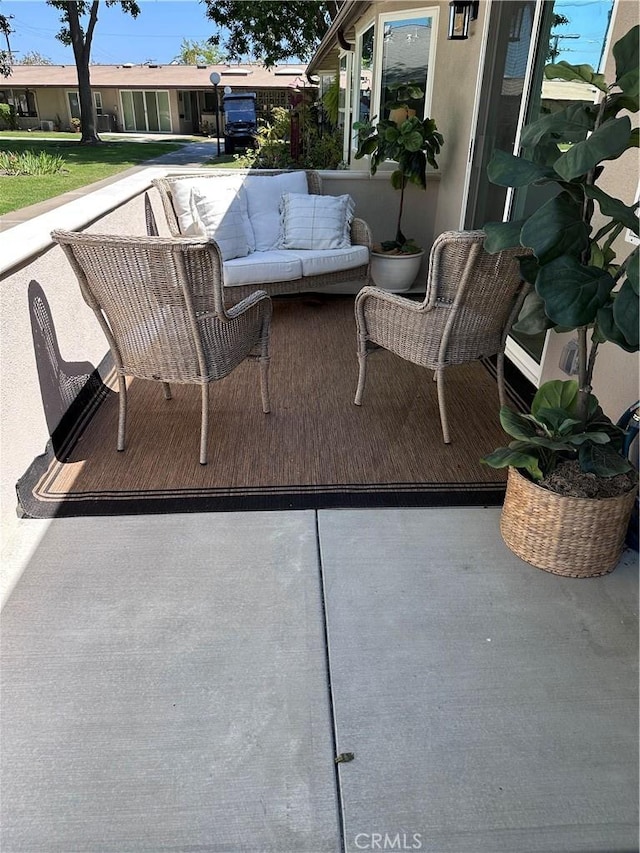 13361 El Dorado Unit 201K, Seal Beach, CA 90740 - view of patio with outdoor lounge area